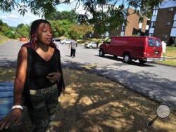 Precious Brown, 20, a resident of the Sherman Hills apartment complex in Wilkes-Barre, says, "This community? It is nice. It's the drama that has to stop." (Times Leader photo/AP)