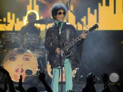  In this May 19, 2013 file photo, Prince performs at the Billboard Music Awards at the MGM Grand Garden Arena in Las Vegas. Several pills taken from Prince's estate in Paisley Park after his death were counterfeit drugs that actually contained fentanyl,a synthetic opioid 50 times more powerful than heroin, an official close to the investigation said Sunday, Aug. 21, 2016. (Photo by Chris Pizzello/Invision/AP, File)