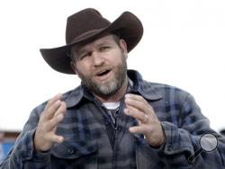  In a Tuesday, Jan. 5, 2016 file photo, Ammon Bundy speaks during an interview at Malheur National Wildlife Refuge, near Burns, Ore. Authorities said Tuesday, Jan. 26, 2016, that Bundy, leader of the armed Oregon group, has been arrested. (AP Photo/Rick Bowmer, File)