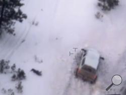 This photo taken from an FBI video shows Robert "LaVoy" Finicum after he was fatally shot by police Tuesday, Jan. 26, 2016 near Burns, Ore. A video released Thursday, Jan. 28, 2016 by the FBI of the shooting death of a spokesman for the armed occupiers of a wildlife refuge shows the man reaching into his jacket before he fell into the snow. The FBI said the man had a gun in his pocket. (FBI via AP)