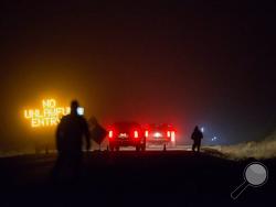 Three SUV proceeds through the Narrows roadblock near Burns, Ore., as FBI agents have surrounded the remaining four occupiers at the Malheur National Wildlife Refuge, on Wednesday, Feb.10, 2016. The four are the last remnants of an armed group that seized the Malheur National Wildlife Refuge on Jan. 2 to oppose federal land-use policies. (Thomas Boyd/The Oregonian via AP)