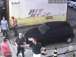 In this Sunday, Aug. 14, 2016 frame from surveillance video released by Brazil Police, swimmer Ryan Lochte, second from right, of the United States, and teammates, appear at a gas station during the 2016 Summer Olympics in Rio de Janeiro, Brazil. A top Brazil police official said the swimmers damaged property at the gas station. (Brazil Police via AP)