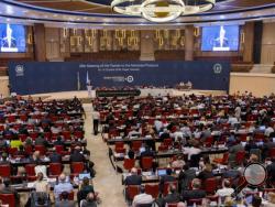 Secretary of State John Kerry, center-left at podium, delivers a speech to the 28th Meeting of the Parties to the Montreal Protocol on Substances that Deplete the Ozone Layer, in Kigali, Rwanda Friday, Oct. 14, 2016. Nations strove Friday for a deal to phase out hydrofluorocarbons from air conditioners and refrigerators as part of efforts to fight climate change. (AP Photo)