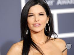 FILE - In this Jan. 31, 2010 file photo, Lauren Sanchez arrives at the Grammy Awards in Los Angeles. TV anchor Sanchez, who is in a relationship with Amazon CEO Jeff Bezos, has filed for divorce the day after Bezos’ divorce was finalized. Sanchez and talent agent Patrick Whitesell, her husband of 14 years, both filed divorce papers Friday, April 5, 2019. They’re seeking joint custody of their two kids. (AP Photo/Chris Pizzello, File)