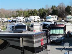 RVs are lined up at the Green River Stables campground near Campbellsville, Ky., which has become a Christmas-season tradition. The Amazon.com facility nearby recruits RV owners to come in as seasonal workers to help fill holiday orders. (AP Photo/Bruce Schreiner)