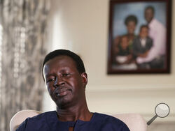 Jacob Mabil pauses during an interview at his home about his two nieces Wednesday, Nov. 8, 2023, in Haslet, Texas. Mabil is one of Sudan's "Lost Boys," and is trying to get his two nieces from African refugee camps to the U.S. to live with him and his family. (AP Photo/LM Otero)