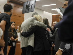 Tom and Gena Hoyer exit the courtroom as Gena could be heard sobbing following the verdict in the trial of Marjory Stoneman Douglas High School shooter Nikolas Cruz at the Broward County Courthouse in Fort Lauderdale, Fla., on Thursday, Oct. 13, 2022. The Hoyer's son, Luke, was killed in the 2018 shootings. A jury spared Cruz from the death penalty Thursday for killing 17 people at a Parkland high school in 2018, sending him to prison for the remainder of his life. (Amy Beth Bennett/South Florida Sun-Sentin