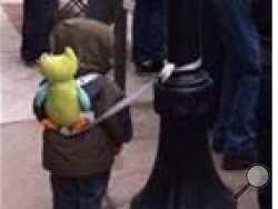 A child is shown tied to a post during Wilkes-Barre's St. Patrick's Day parade.