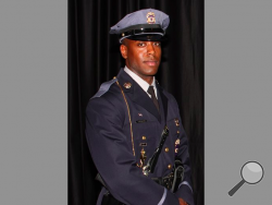 This undated photo provided by the Prince George's County Police Department shows officer Jacai Colson, a four-year veteran of the Maryland county's police force. A gunman fired outside a Maryland police station on Sunday, March 13, 2016, prompting a gun battle that killed Colson and wounded the suspect, authorities said. (Prince George's County Police Department via AP)