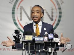 Rev. Al Sharpton speaks during a news conference in New York, Tuesday, April 8, 2014. Sharpton says a report that he spied on New York Mafia figures for the FBI in the 1980s is old news. (AP Photo/Seth Wenig)