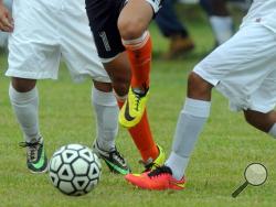 In this Wednesday, Sept. 24, 2014 file photo, students compete in a high school soccer game in Burgaw, N.C. (AP Photo/Wilmington Star-News, Mike Spencer)