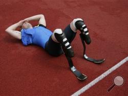 In this Sunday June 1, 2008 file photos double-amputee sprinter Oscar Pistorius catches his breath after competing in the 400 meters of the Dutch Open Paralympics event in Emmeloord, Netherlands. With his athletic triumphs tarnished by the killing of his girlfriend, Reeva Steenkamp. Pistorius, now 27, faces possibly being sent to prison until he is older than 50. Pistorius goes on trial Monday March 3, 2014. (AP Photo/Peter Dejong-File)