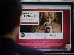 A June 10, 2015 photo from files showing Ashley Madison's Korean web site on a computer screen in Seoul, South Korea. (AP Photo/Lee Jin-man, File)