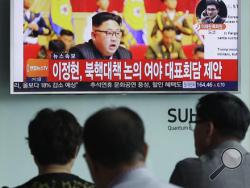 People watch a TV news program showing North Korean leader Kim Jong Un at the Seoul Railway Station in Seoul, South Korea, Friday, Sept. 9, 2016. North Korea said Friday it conducted a "higher level" nuclear warhead test explosion, which it trumpeted as finally allowing it to build "at will" an array of stronger, smaller and lighter nuclear weapons. It is Pyongyang's fifth atomic test and the second in eight months. The letters read " South Korean parties hold emergency meetings on North Korea's nuke test."