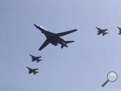 U.S. B-1 bomber, center, flies over Osan Air Base with U.S. jets in Pyeongtaek, South Korea, Tuesday, Sept. 13, 2016. The United States has flown nuclear-capable supersonic bombers over ally South Korea in a show of force meant to cow North Korea after its fifth nuclear test and also to settle rattled nerves in the South. (AP Photo/Lee Jin-man)
