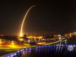 The view from Exploration Tower at Port Canaveral of the SpaceX Falcon 9 launch to the International Space Station from Launch Complex 40 at Cape Canaveral Air Force Station at 1:52 a.m. Sunday morning Sept. 21, 2014. This is a two and a half minute time exposure of the launch. (AP/Malcolm Denemark/Florida Today)