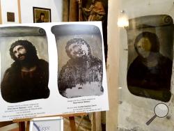 View of the deteriorated version of 'Ecce Homo' mural by 19th century painter Elias Garcia Martinez, right, next to a copy of the original, left, at the Borja Church in Zaragoza, Spain, Wednesday, March 16, 2016. (AP Photo/Javier Vinuela)