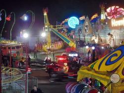 In this photo provided by WNCN, emergency crews respond to the scene where a ride malfunctioned at the North Carolina State Fair, Thursday, Oct. 24, 2013 in Raleigh, N.C. Several people were sent to the hospital with unknown injuries. (AP Photo/WNCN, Alison Blevins)
