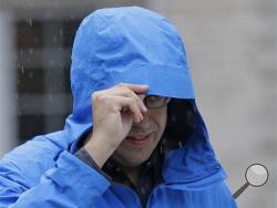 In this July 7, 2015, file photo, Subway restaurant spokesman Jared Fogle walks to a waiting car as he leaves his home in Zionsville, Ind. (AP Photo/Michael Conroy, File)