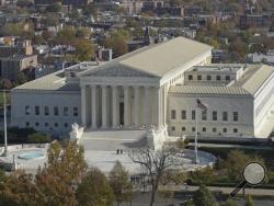 This Nov. 15, 2016 photo shows a view of the Supreme Court from the Capitol Dome, on Capitol Hill in Washington. The eight-justice court is hearing arguments Monday in two cases that deal with the same basic issue of whether race played too large a role in the drawing of electoral districts, to the detriment of African-Americans. (AP Photo/Susan Walsh)