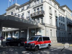 A police vehicle is parked outside of the five-star hotel Baur au Lac in Zurich, Switzerland, Wednesday morning, May 27, 2015. (Ennio Leanza/Keystone via AP)