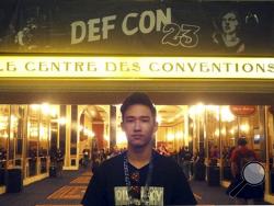 This August 2014 photo provided by Shu Chien shows her son Moshe Kai Cavalin at the DEF CON 23 hacker's conference in Las Vegas. Cavalin, of San Gabriel, Calif., earned a bachelor’s in math from UCLA at age 15, and is taking online classes through Brandeis University, near Boston, towards a master’s in cybersecurity. He’s also working for NASA, where he is developing aircraft tracking technology. (Shu Chien via AP)
