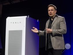 Elon Musk, CEO of Tesla Motors Inc., unveils the company’s newest product, Powerpack in Hawthorne, Calif., Thursday, April 30, 2015. (AP Photo/Ringo H.W. Chiu)