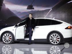  In this Sept. 29, 2015, file photo, Elon Musk, CEO of Tesla Motors Inc., introduces the Model X car at the company's headquarters in Fremont, Calif. (AP Photo/Marcio Jose Sanchez, File)