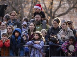 People watch floats being inflated in preparation for the Macy's Thanksgiving Day Parade, Wednesday, Nov. 27, 2024, in New York. (AP Photo/Yuki Iwamura)