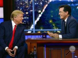 n this photo provided by CBS, Republican presidential candidate Donald Trump, left, joins host Stephen Colbert on the set of “The Late Show with Stephen Colbert,” Tuesday, Sept. 22, 2015, in New York. (John Paul Filo/CBS via AP)