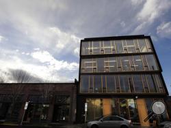 This Nov. 15, 2016, photo shows Lever Architecture headquarters, a four-story all-wood building built using cross-laminated timber, or CLT, in Portland, Ore. CLT is made up of 2-by-4 beams laid out in perpendicular layers that are then glued together to make giant panels. (AP Photo/Don Ryan)