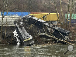 FILE - This photo provided by Nancy Run Fire Company shows a train derailment along a riverbank in Saucon Township, Pa., March 2, 2024. The collision highlights the shortcomings of the automated braking system that was created to prevent such crashes. None of the circumstances the National Transportation Safety Board described Tuesday, March 26, in its preliminary report on the derailment would have triggered the automated positive train control system to stop the trains. (Nancy Run Fire Company via AP, Fil