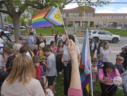 FILE - Bonneville Elementary School parents and students gather during a block party supporting trans and non binary students and staff on April 29, 2024, in Salt Lake City. Transgender activists have flooded a Utah tip line created to alert state officials to possible violations of a new bathroom law with thousands of hoax reports in an effort to shield trans residents and their allies from any legitimate complaints that could threaten their safety. (AP Photo/Rick Bowmer, File)