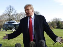 President Donald Trump talks with reporters before boarding Marine One on the South Lawn of the White House in Washington, Thursday, March 28, 2019, for the short trip to Andrews Air Force Base in Maryland. Trump is traveling to Michigan to speak at a rally before spending the weekend at his Mar-a-Lago estate in Florida. (AP Photo/Susan Walsh)