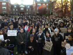 Students protest on the Brown University campus, Wednesday, Nov. 16, 2016, in Providence, R.I., to demand that students and employees be protected against immigration proceedings following the election of Donald Trump as president. Hundreds of students walked out of their classrooms and activities at 3 p.m. (AP Photo/Jennifer McDermott)