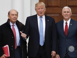 President-elect Donald Trump, center, and Vice President-elect Mike Pence, right, pose with investor Wilbur Ross at the Trump National Golf Club Bedminster clubhouse, Sunday, Nov. 20, 2016, in Bedminster, N.J.. (AP Photo/Carolyn Kaster)