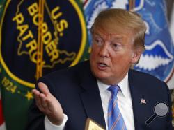 In this April 5, 2019 photo, President Donald Trump participates in a roundtable on immigration and border security at the U.S. Border Patrol Calexico Station in Calexico, Calif. Trump said Friday he is considering sending "Illegal Immigrants" to Democratic strongholds to punish them for inaction— just hours after White House and Homeland Security officials insisted the idea was dead on arrival. (AP Photo/Jacquelyn Martin)