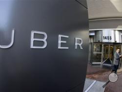 In this Dec. 16, 2015, file photo, a man leaves the headquarters of Uber in San Francisco. Ride-hailing company Uber received a complaint about erratic driving by Jason Dalton Saturday night, but says it never could have predicted the violent acts Dalton allegedly committed. Dalton was charged Monday, Feb. 22, 2016, with killing six people in random shootings in Kalamazoo, Mich. (AP Photo/Eric Risberg, File)