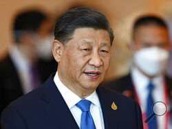 FILE - China's President Xi Jinping arrives to attend the APEC Economic Leaders Meeting during the Asia-Pacific Economic Cooperation, APEC summit, Nov. 19, 2022, in Bangkok, Thailand. The CIA director says U.S. intelligence shows that China’s President Xi Jinping has instructed his country’s military to “be ready by 2027” to invade Taiwan. But CIA Director William Burns also says Xi may be currently harboring doubts about his ability to make a move against Taiwan, given Russia’s experience in its war with U