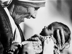 In this 1978 file photo, Mother Teresa, head of the Missionaries of Charity order, cradles an armless baby girl at her order's orphanage in what was then known as Calcutta, India, in 1978. (AP Photo/Eddie Adams, File) 