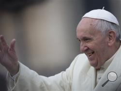 Pope Francis waves as he is driven through the crowd ahead of his weekly general audience in St. Peter's Square, at the Vatican. (AP Photo/Felipe Dana)