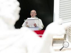 Pope Francis recites the Angelus noon prayer from his studio window overlooking St. Peter's Square at the Vatican, Sunday, Sept. 6, 2015. (AP Photo/Riccardo De Luca)
