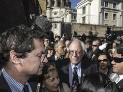 Backdropped by St. Peter's Basilica dome, US presidential candidate Bernie Sanders meets reporters outside the Perugino gate at the Vatican, Friday, April 15, 2016. Sanders spoke at a conference commemorating the 25th anniversary of "Centesimus Annus," a high-level teaching document by Pope John Paul II on the economy and social justice at the end of the Cold War. (Angelo Carconi/ANSA via AP)