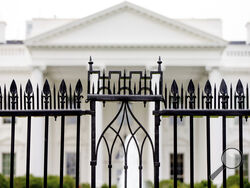 FILE - The White House is visible through the fence at the North Lawn in Washington, on June 16, 2016. A driver died Saturday night, May 4, 2024 after crashing a vehicle into a gate at the White House, authorities said. (AP Photo/Andrew Harnik, File)