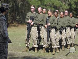  In this Feb. 21, 2013 file photo, female recruits stand at the Marine Corps Training Depot on Parris Island, S.C. New physical standards established so women can compete for combat posts in the Marine Corps have weeded out many of the female hopefuls. But data obtained by The Associated Press shows they’re also disqualifying some men. (AP Photo/Bruce Smith, File)