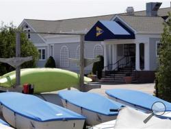 In this Monday, June 20, 2016 photo, small boats are stored at the Westerly Yacht Club in Westerly, R.I. Wives can join the club as associate, non-voting members, but unmarried women can't. A vote to change the nearly century-old policy failed last week, with 171 men voting to uphold it. Women, and many men, are not happy. (AP Photo/Elise Amendola)