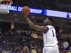 Duke's s Zion Williamson (1) drives to the basket against North Dakota State in a first-round game in the NCAA men’s college basketball tournament in Columbia, S.C., Friday, March 22, 2019. (AP Photo/Richard Shiro)
