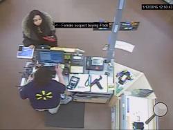 Hemlock Township Police are looking for the woman pictured buying iPads in this picture.