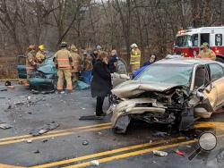 Rescuers work after a two-car collision on Route 11 Thursday. (Press Enterprise/Jimmy May)