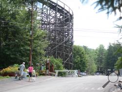 With the Twister nearby, Sarah and Karl Hoffman walk their dogs, Molly and Ross, through the campground at Knoebels Amusement Resort Thursday afternoon. (Special to the Press Enterprise/Kevin Stankiewicz)